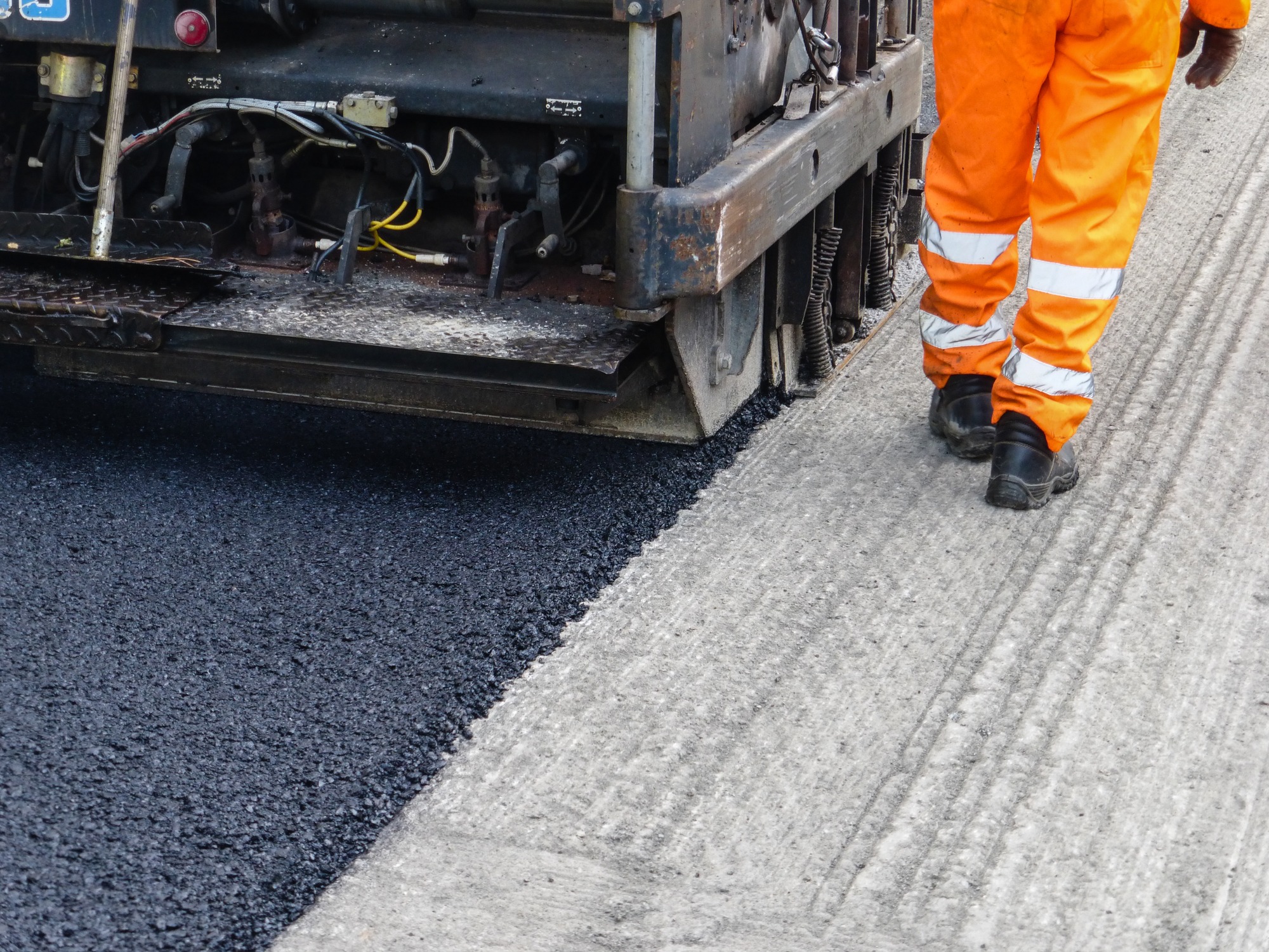 Worker intent in the resurfacing of a road with paver